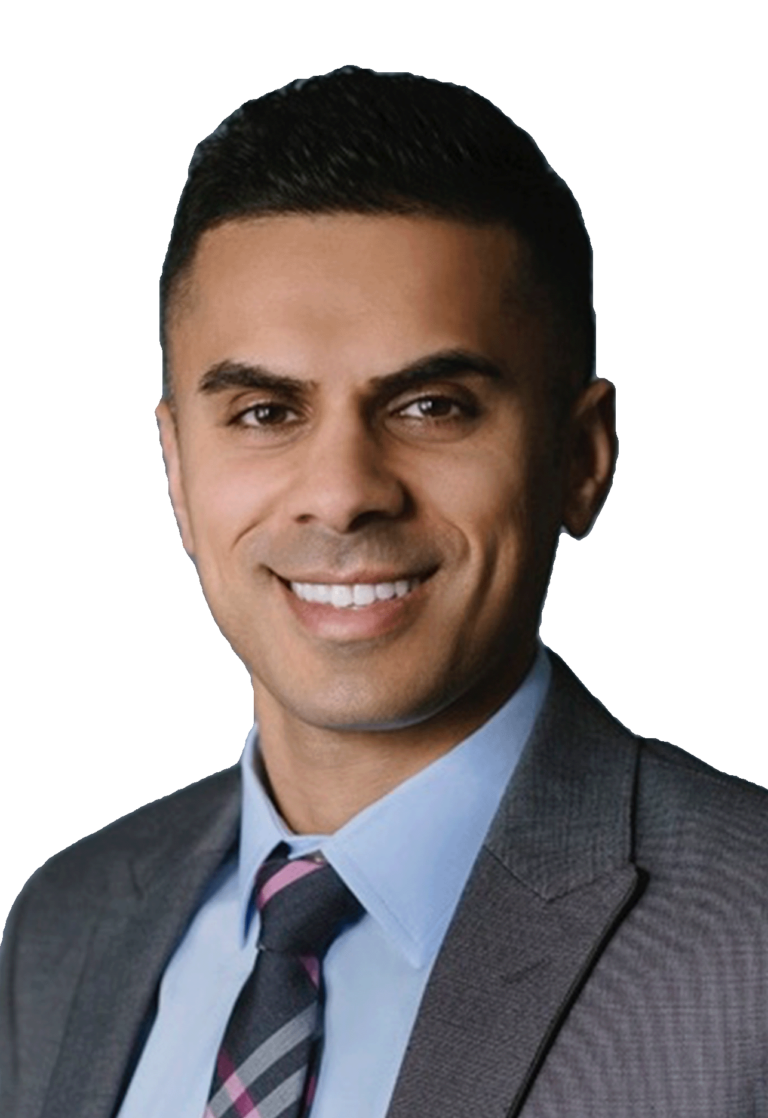 Black and white headshot of Dr. Desai in a dapper suit and tie