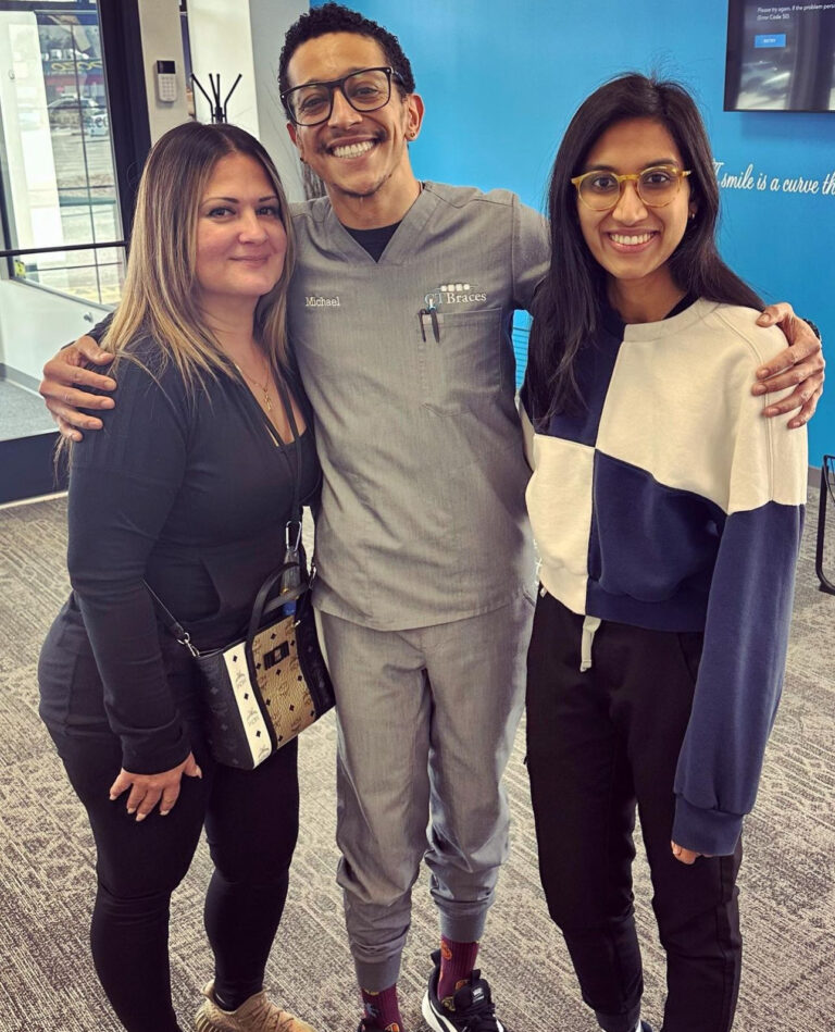 A CTBraces nurse hugging two satisfied clients.