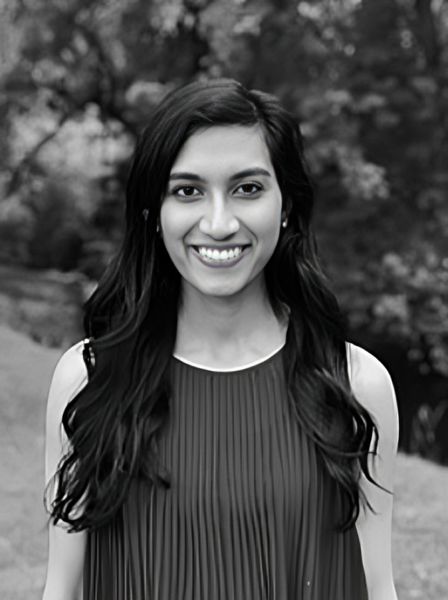 Black and white headshot of orthodontist in CT Dr. Amirtha Hariharan in a skirt