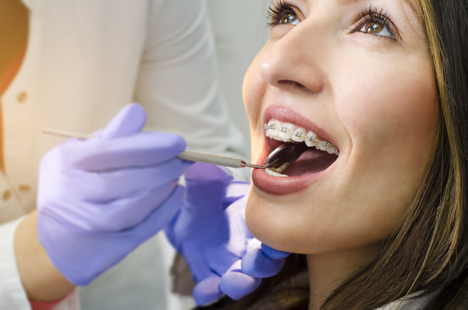 Woman smiling after receiving emergency orthodontic treatment in Danbury, CT