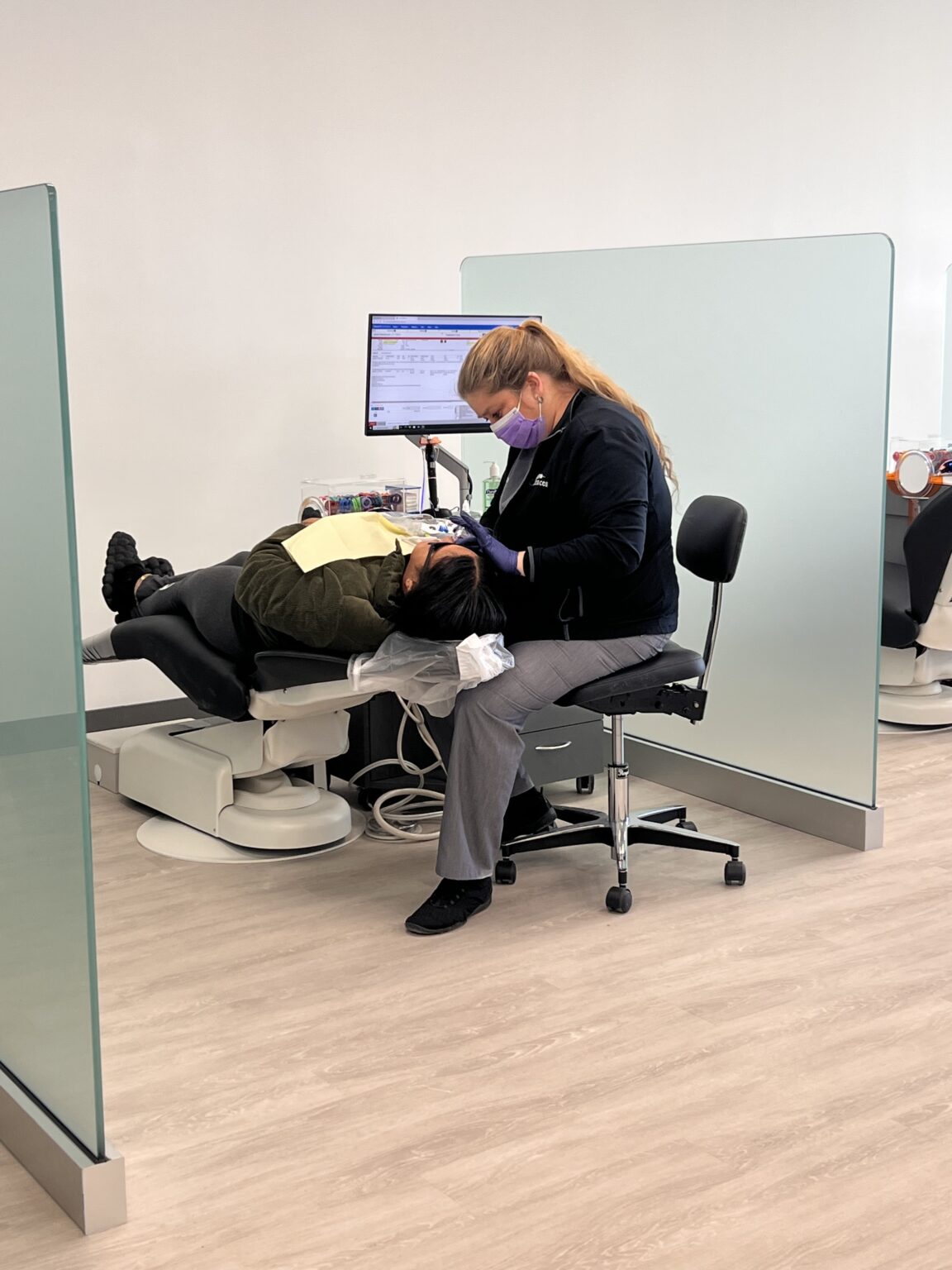 Orthodontic assistant examining the bite of a patient that came in for emergency orthodontic treatment